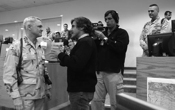 FOX News Reporter Geraldo Rivera interviews LTG Thomas Metz in Baghdad in 2004. LTC Dan Baggio, III Corps PAO, monitors the interview.